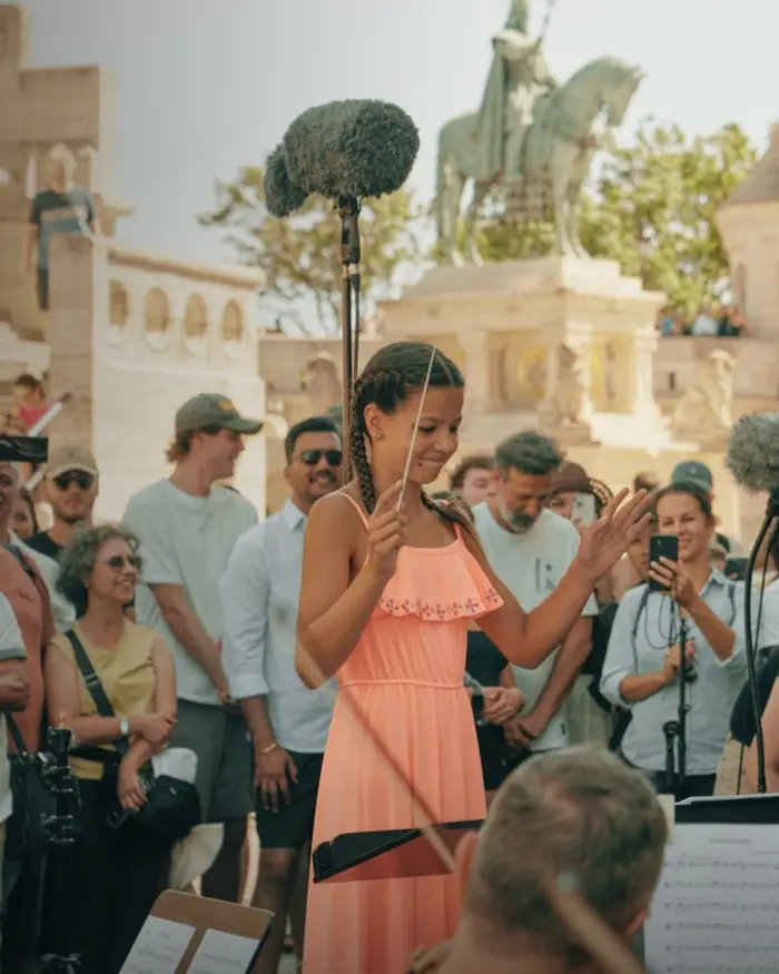 A girl conducts the orchestra